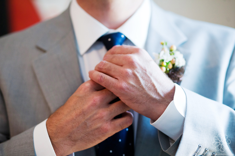 Groom wearing gray and navy