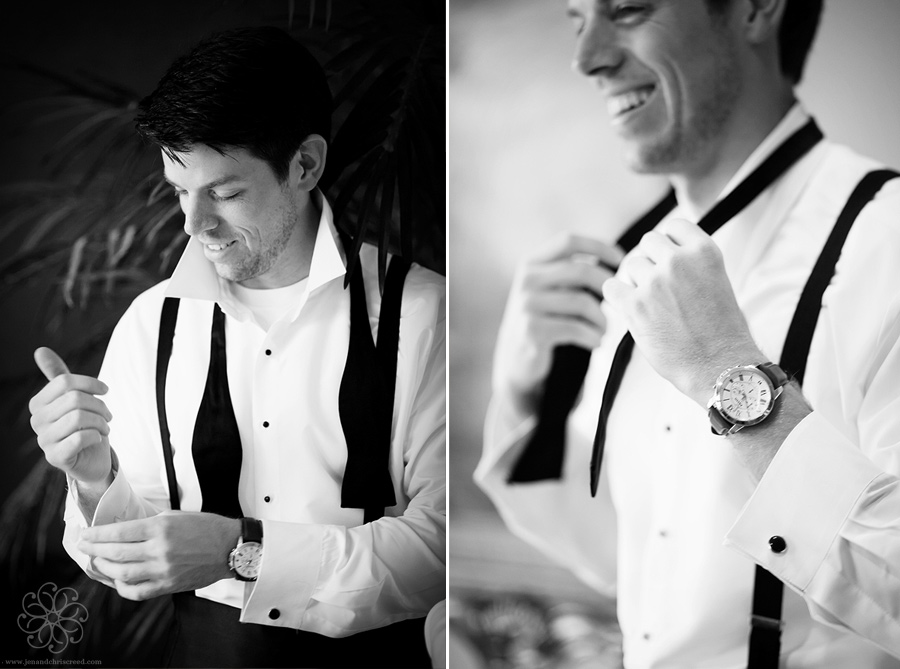 groom tying a bowtie