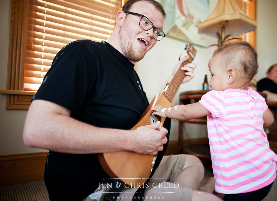 baby playing guitar