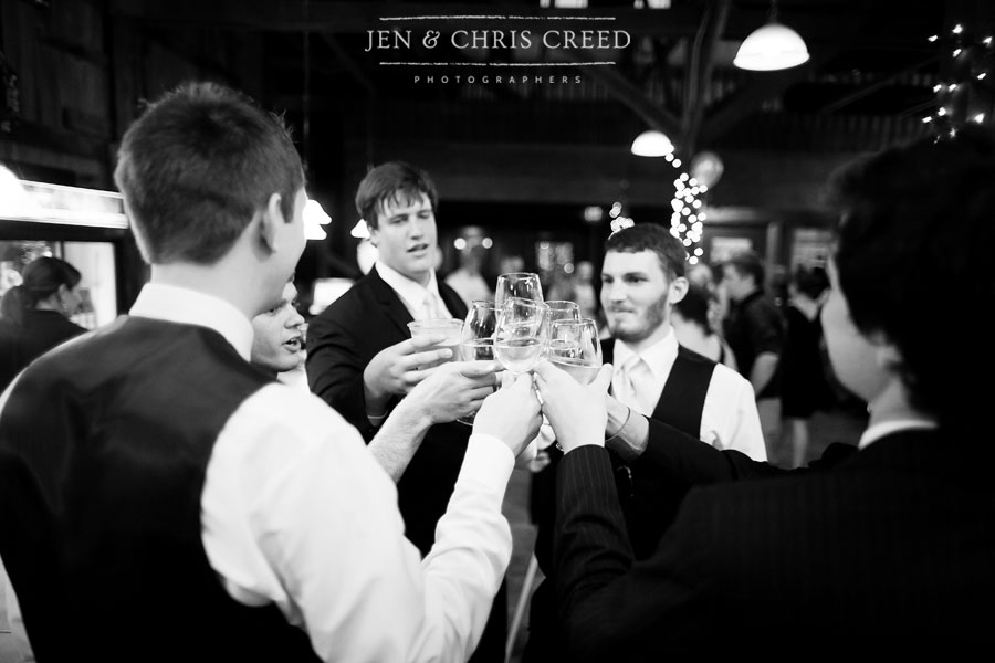 groom and groomsmen toasting