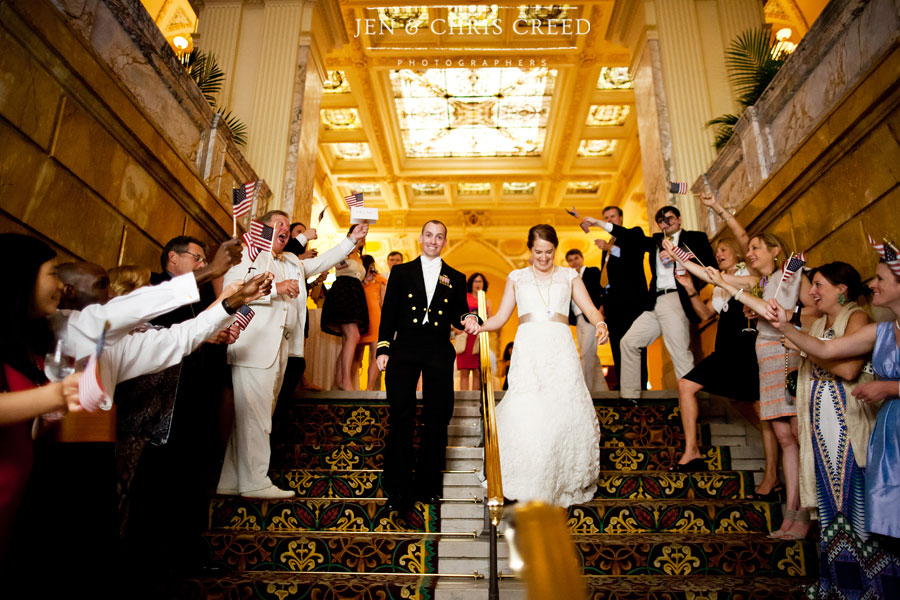 Military wedding exit with flags