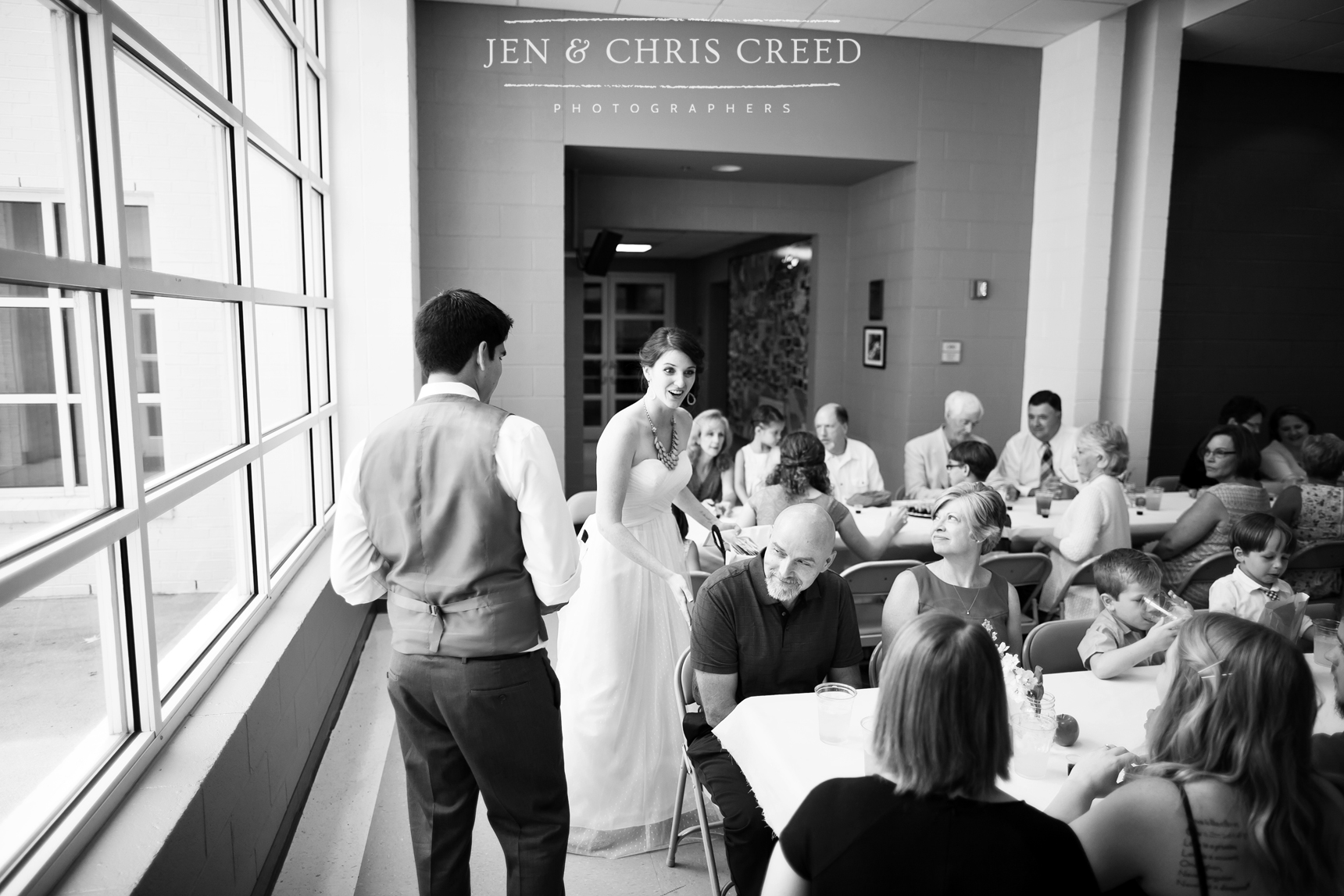 bride and groom serving guests