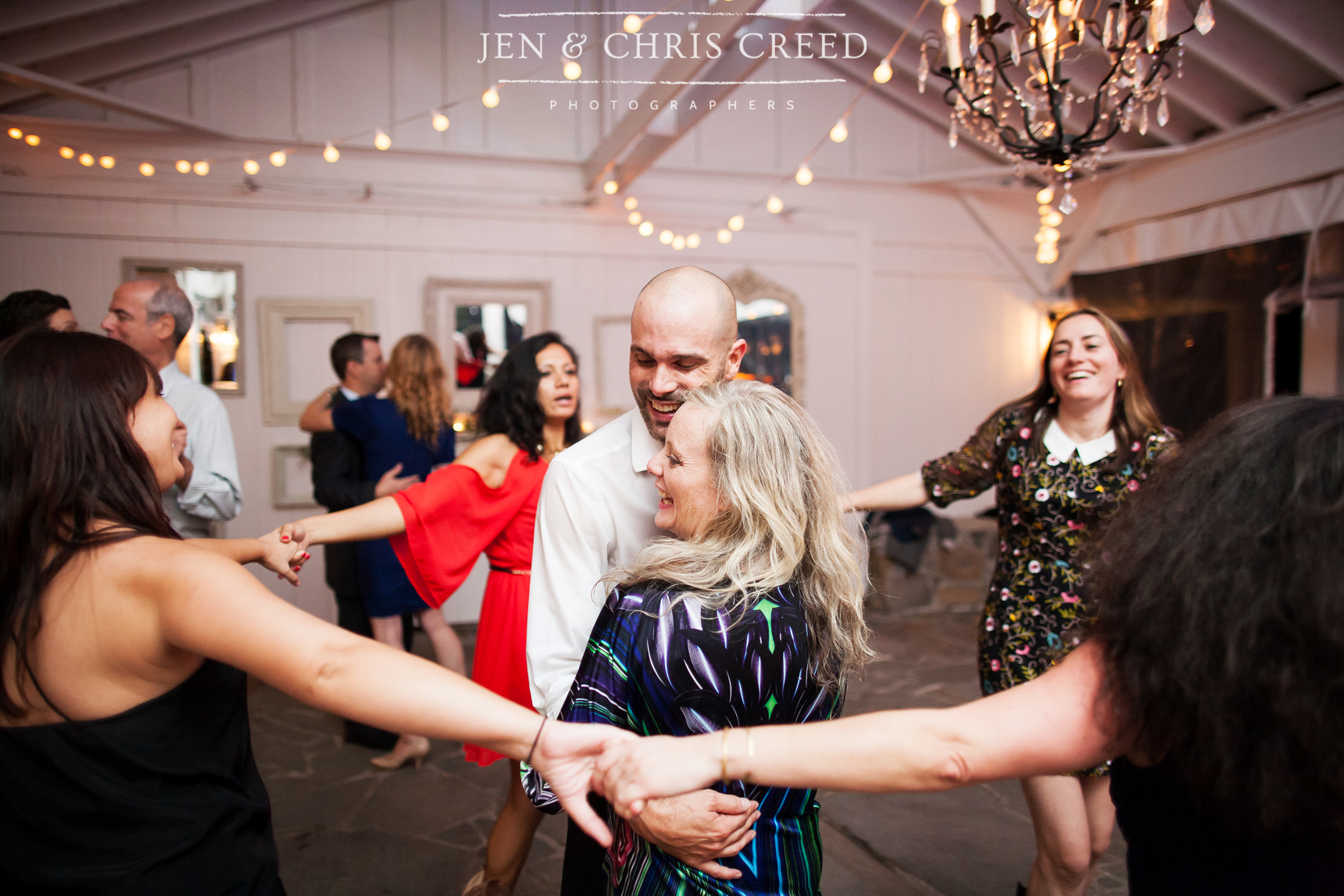 bride, groom, and friends at reception