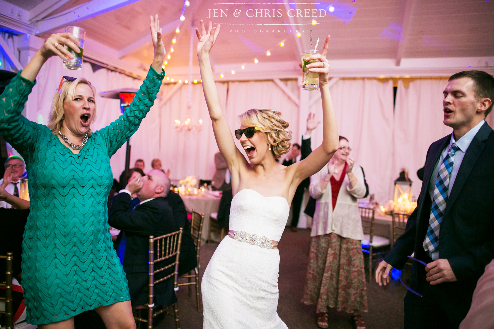 bride in sunglasses at reception