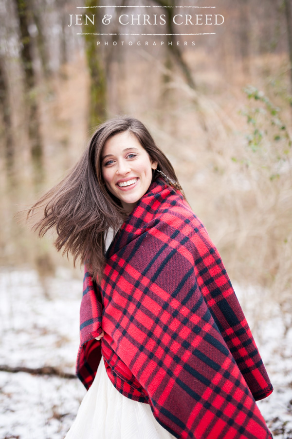 girl spinning in the woods