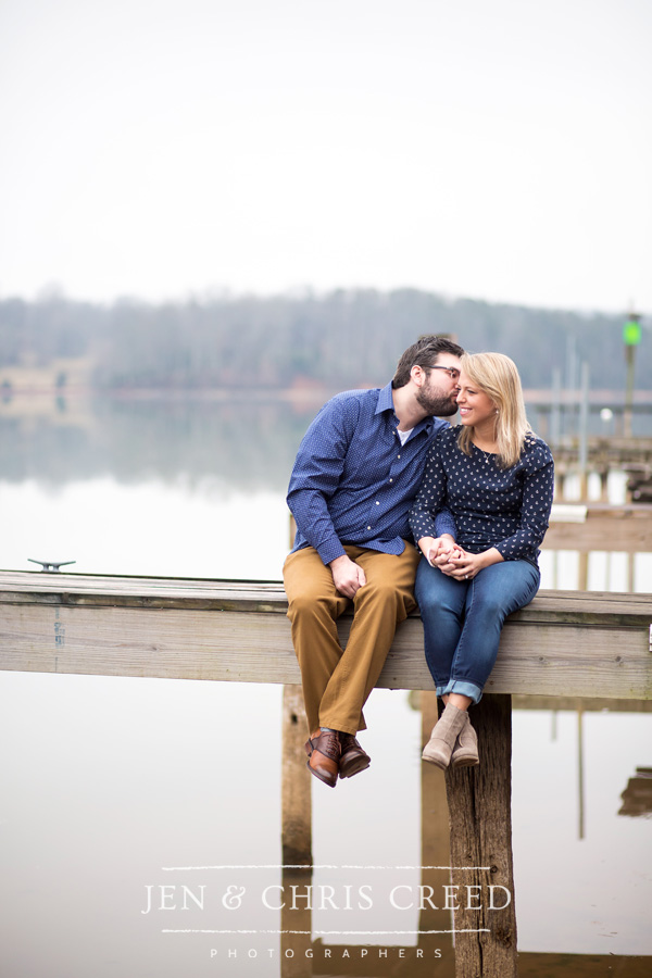 couple kissing on dock
