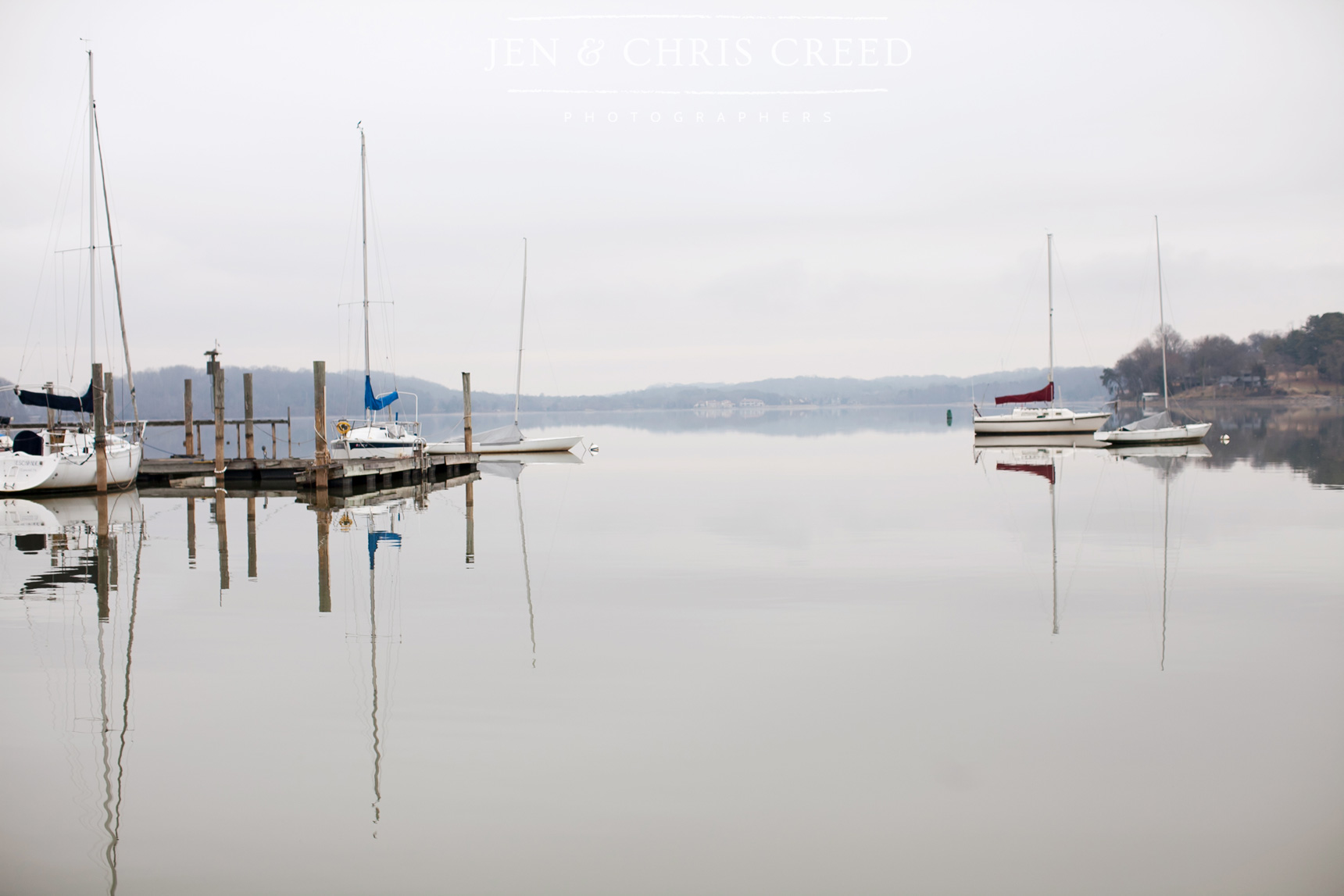 sailboats on calm lake