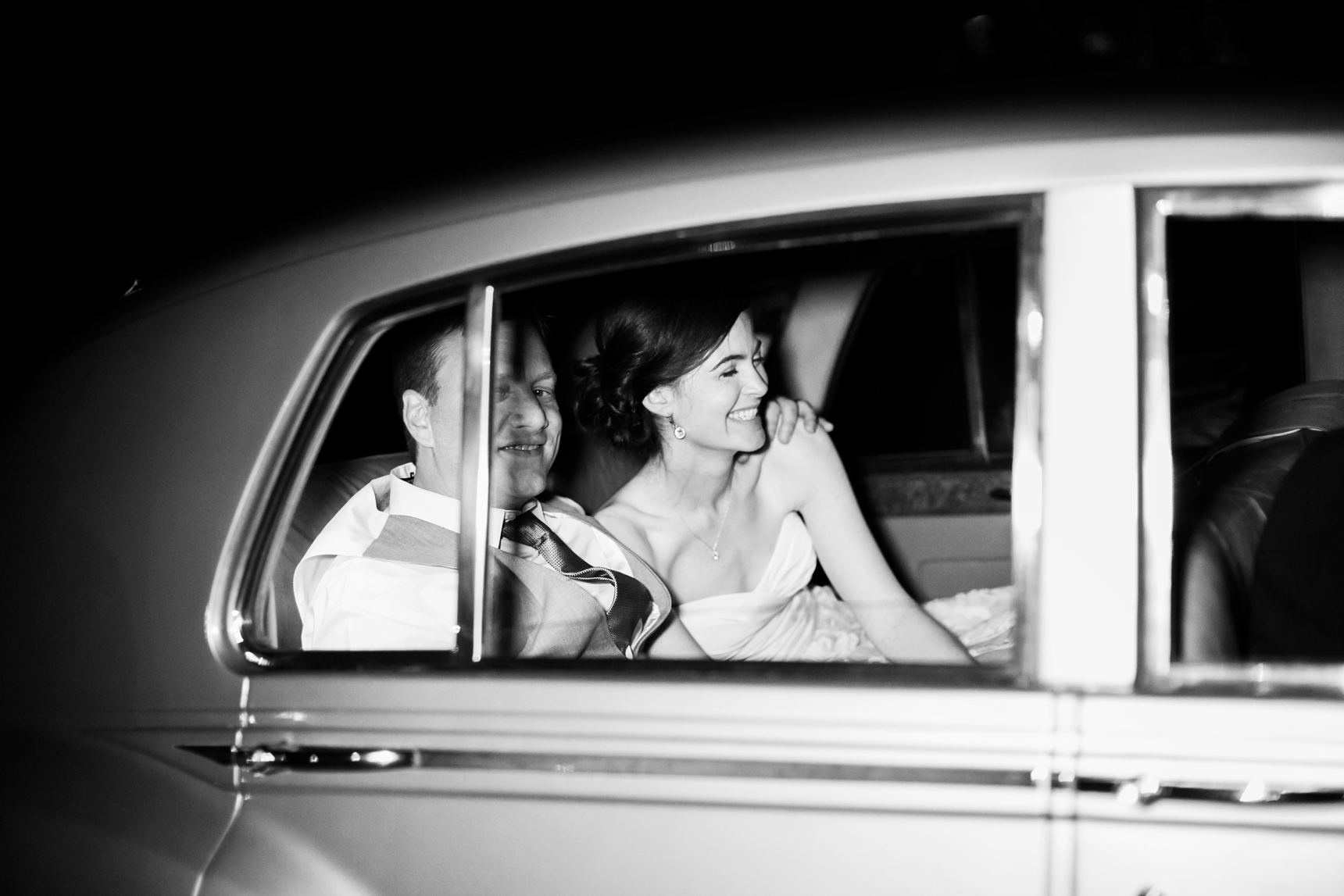 bride and groom leaving reception