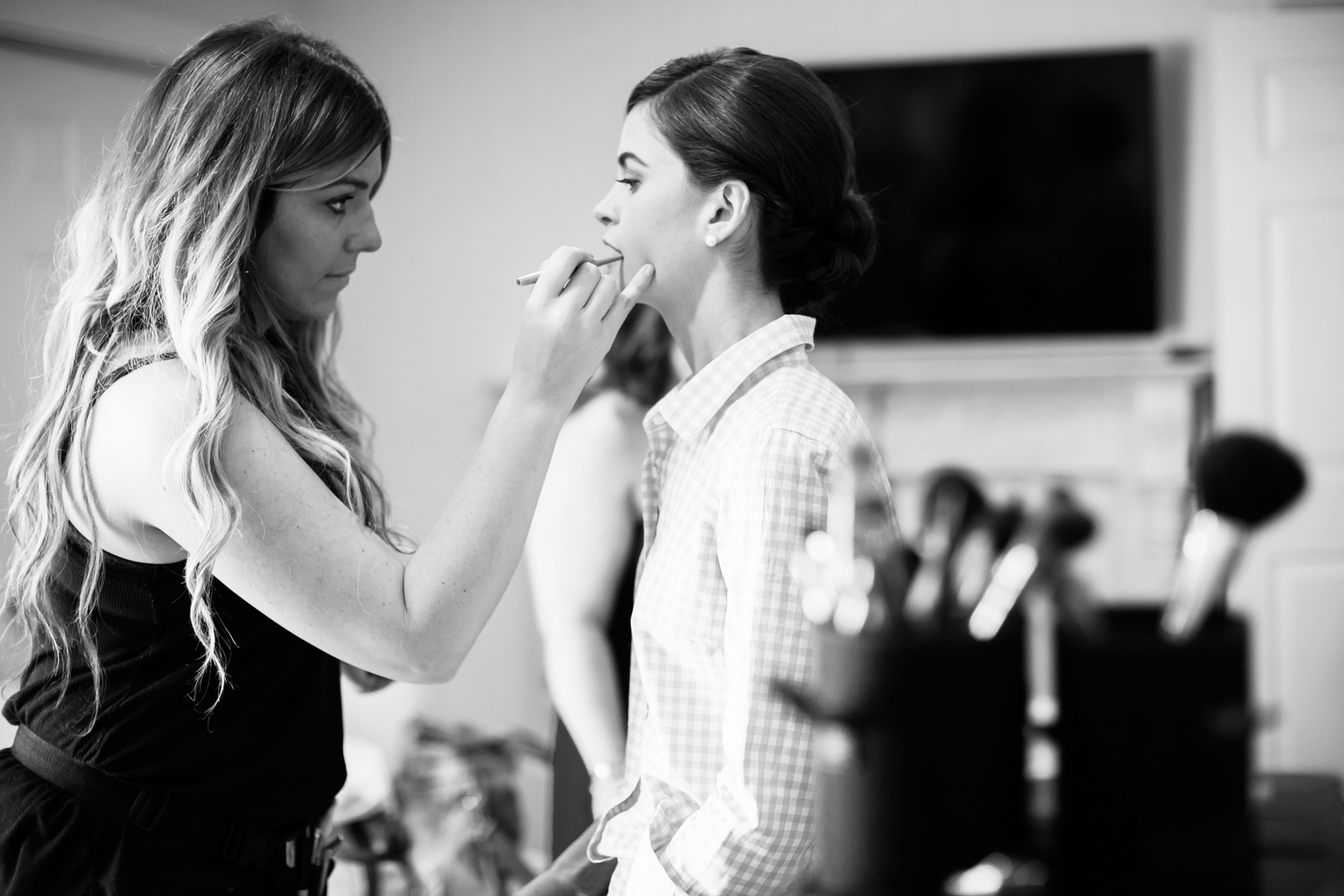 bride getting makeup done