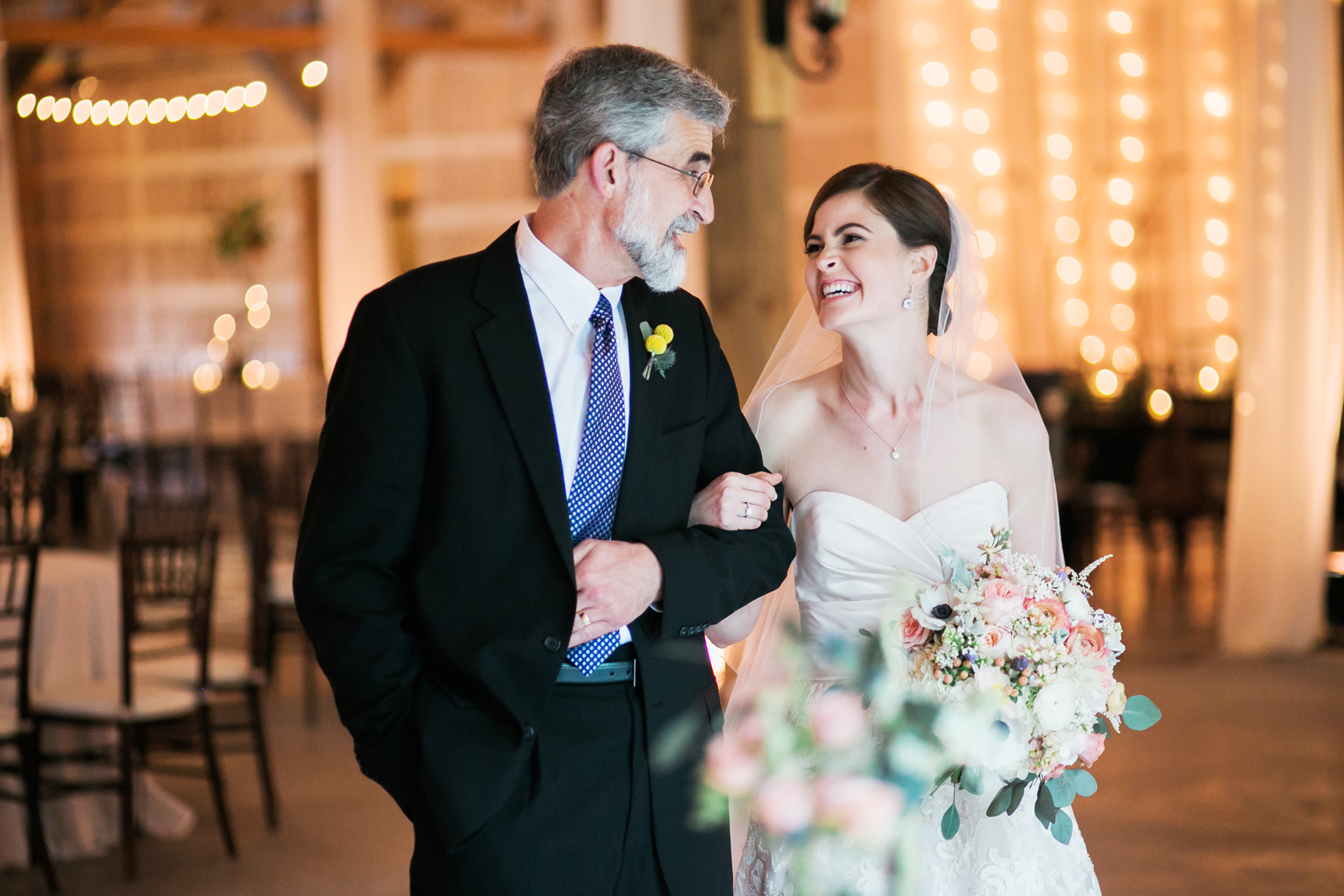 bride with dad laughing