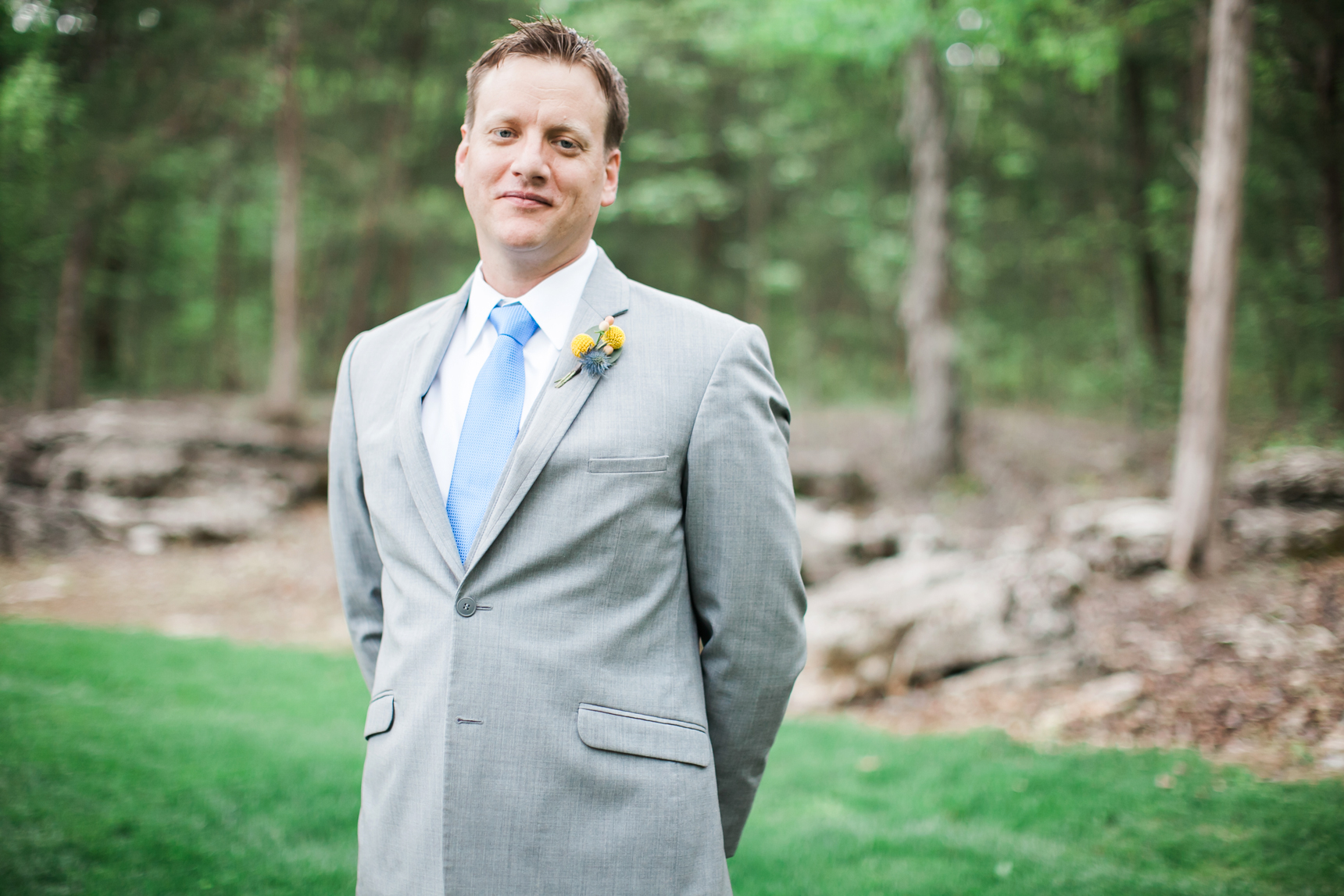 groom in gray suit