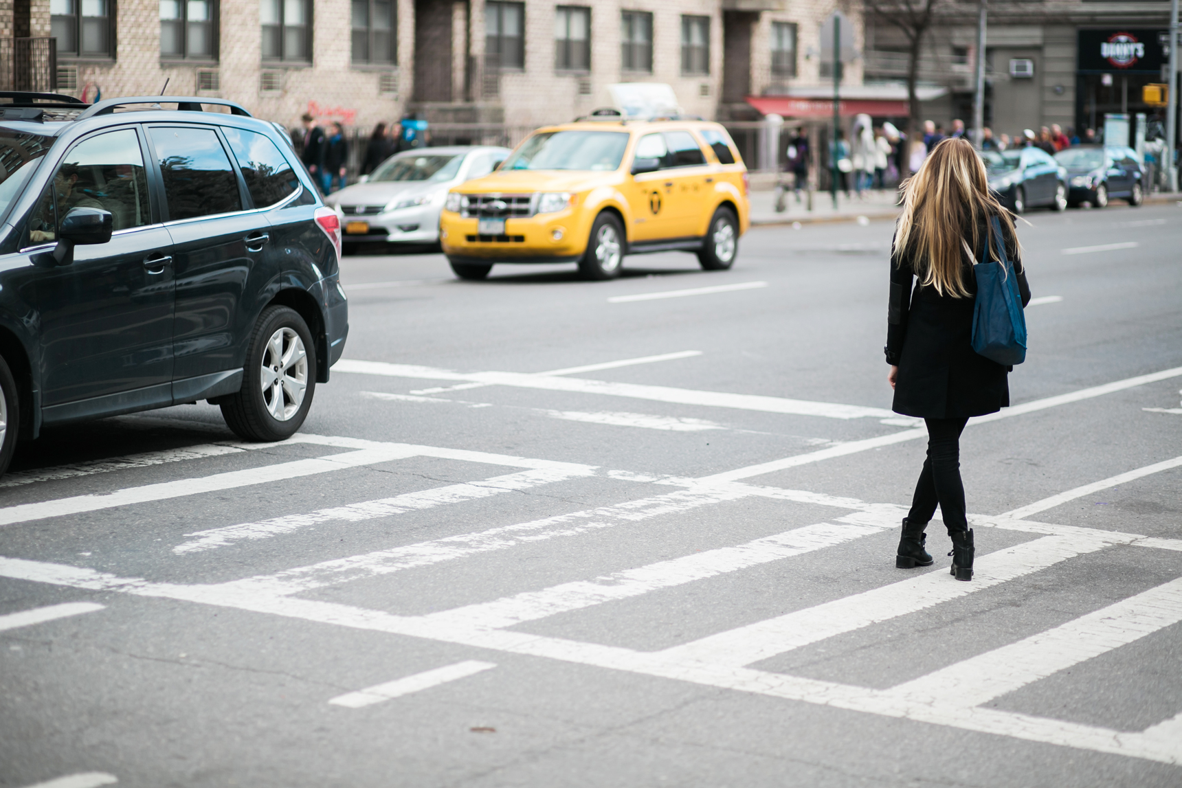 long haired girl waiting for cab