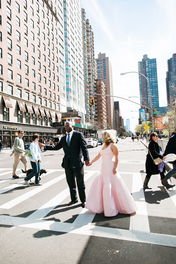 man in suit hailing cab in NYC