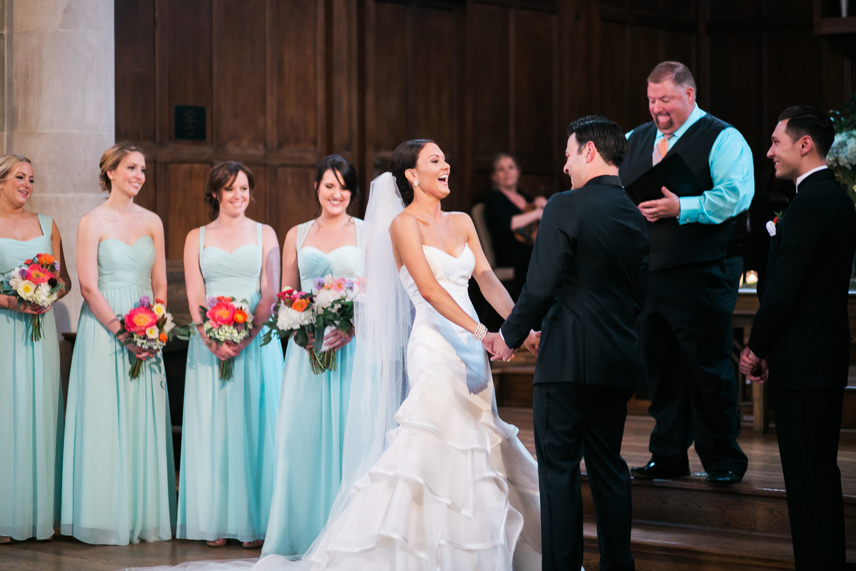 bride laughing during ceremony