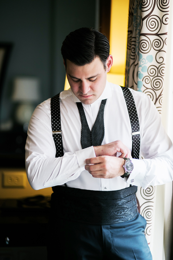 groom adjusting cufflinks