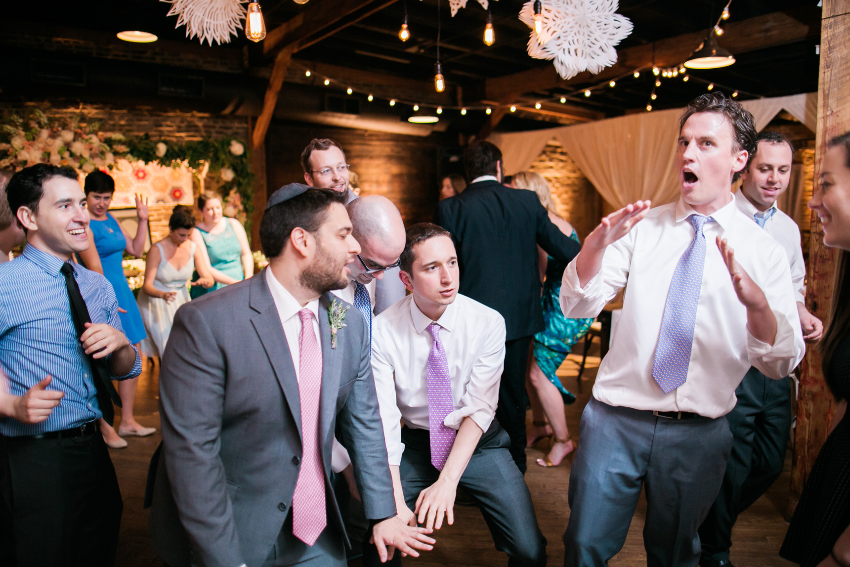 Groom dancing at reception