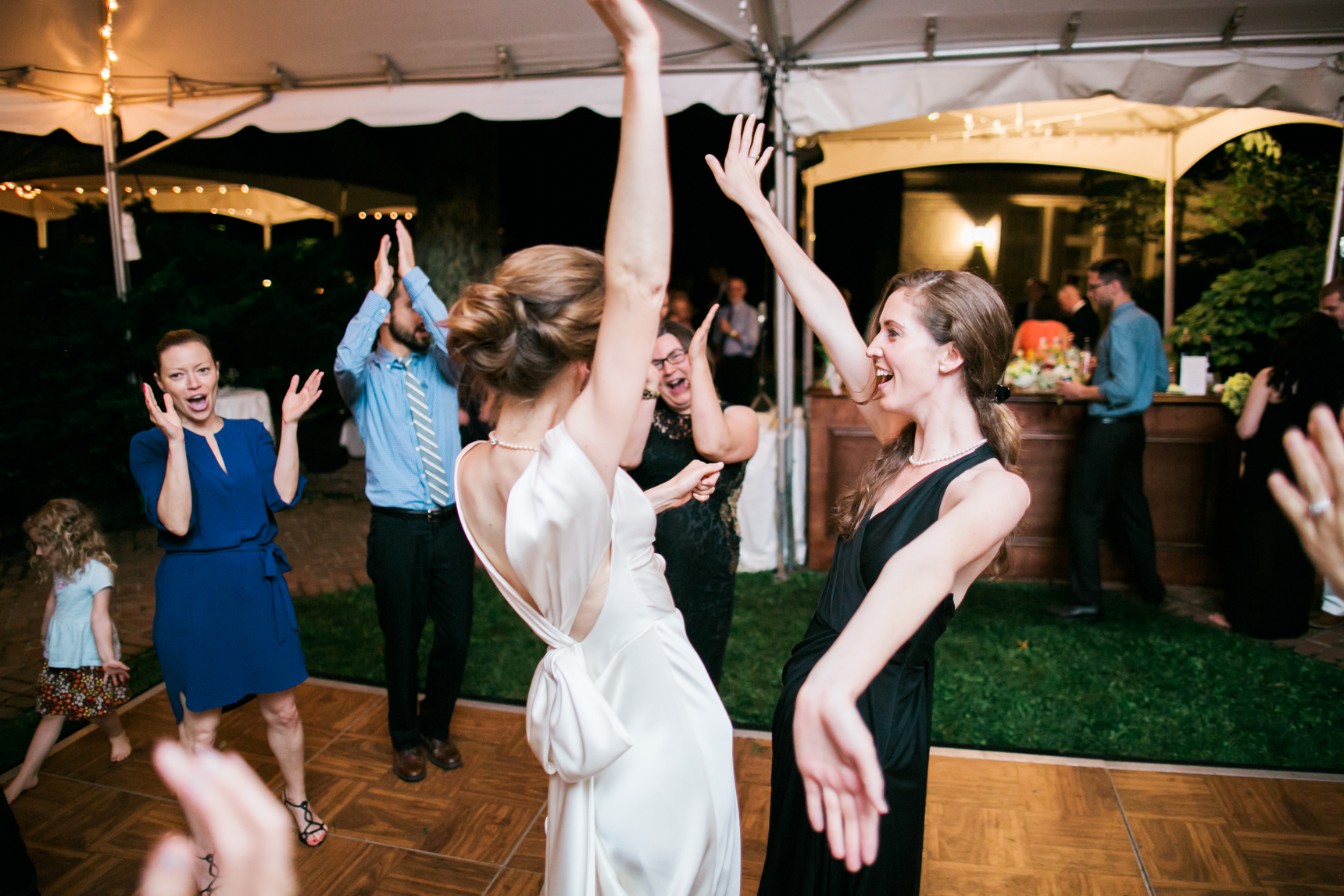 Bride dancing with sister