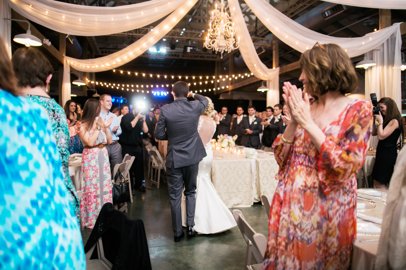 Bride and groom announced into reception