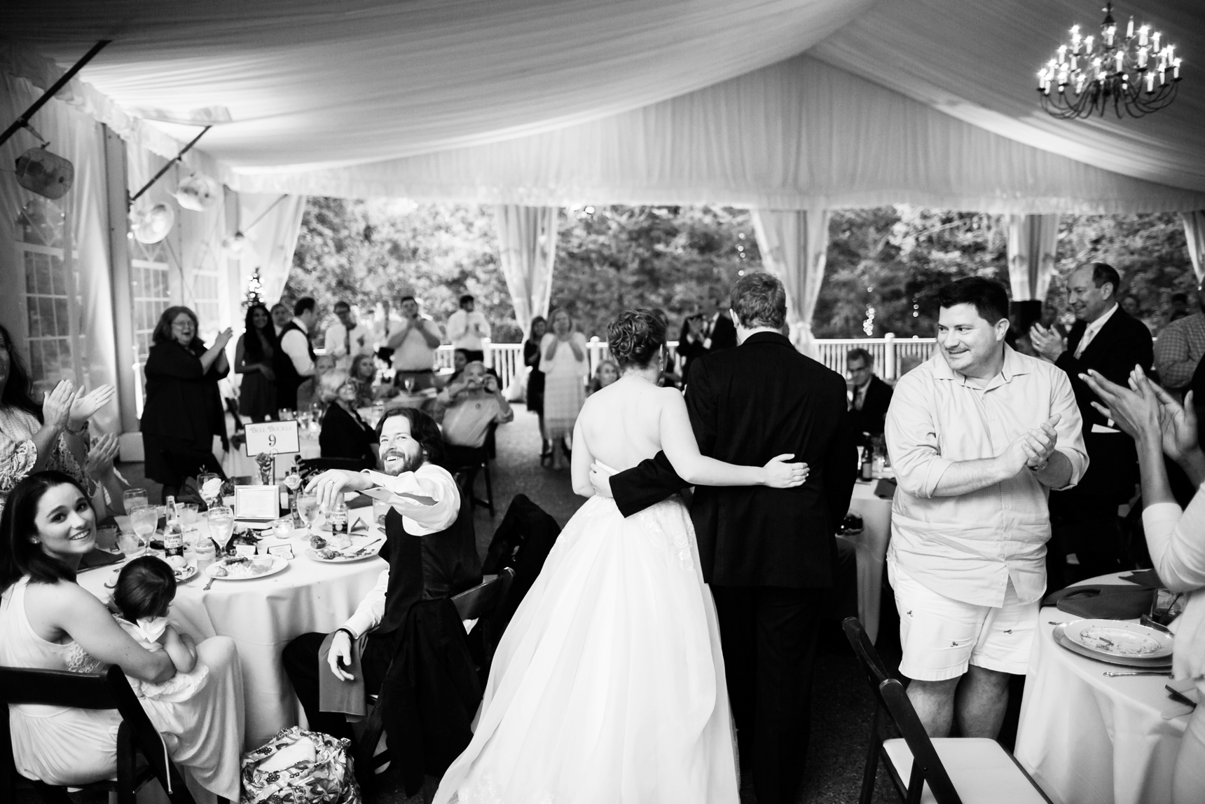 Bride and groom entering reception