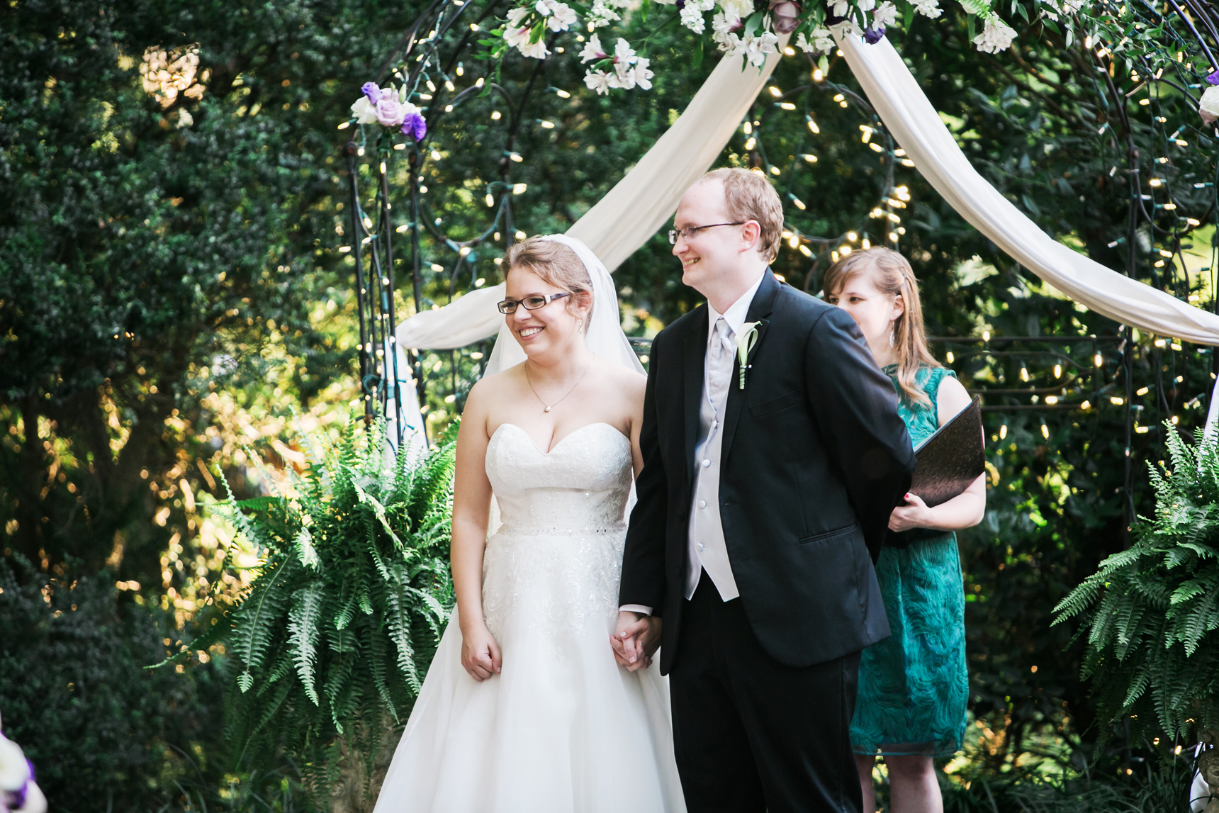 Bride and groom listening to reading