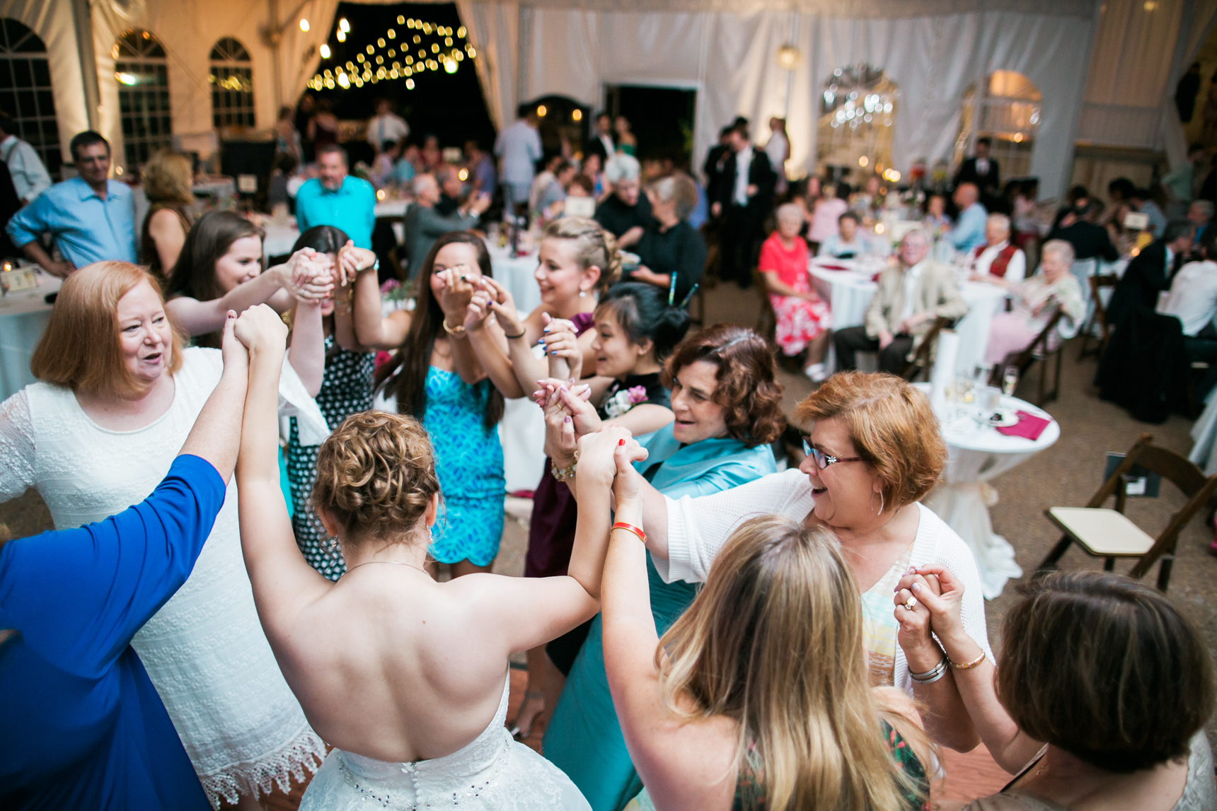 Bride dancing with family