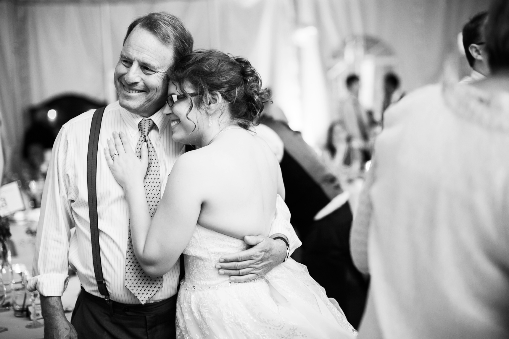 Dad hugging bride