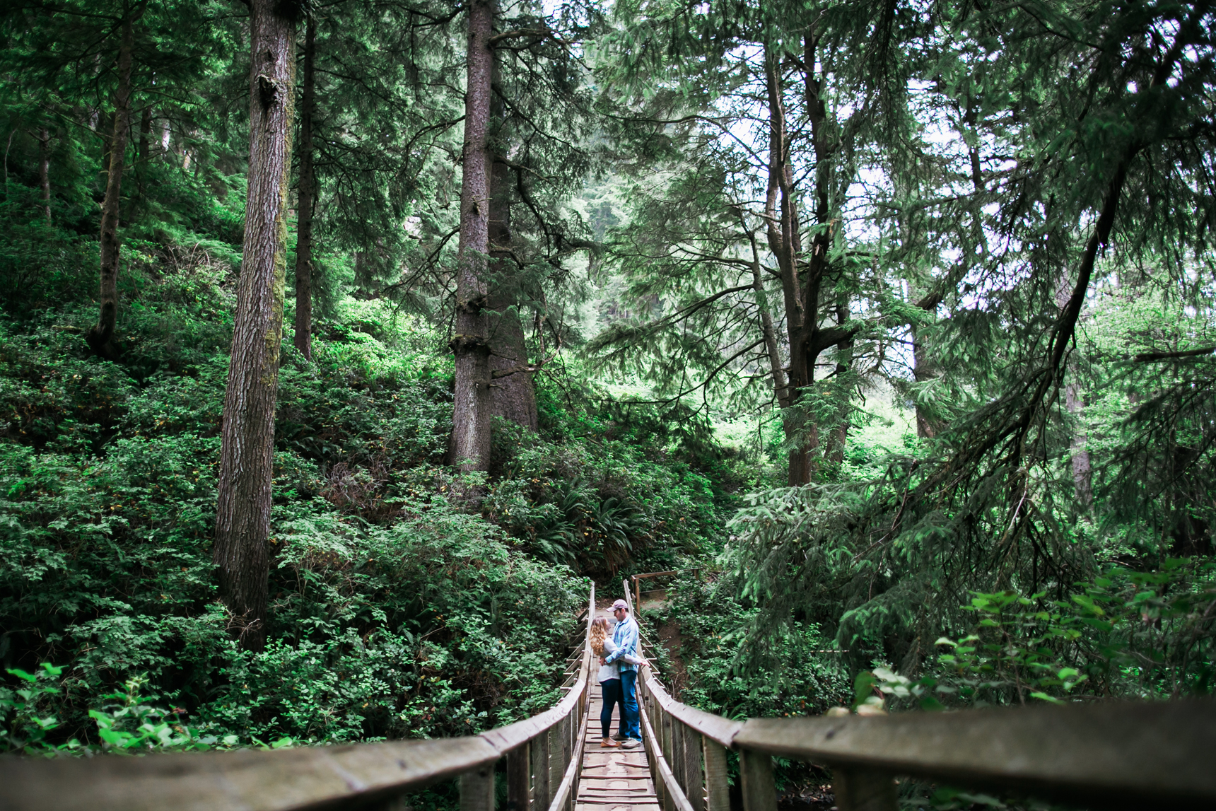 Couple kissing on bridge