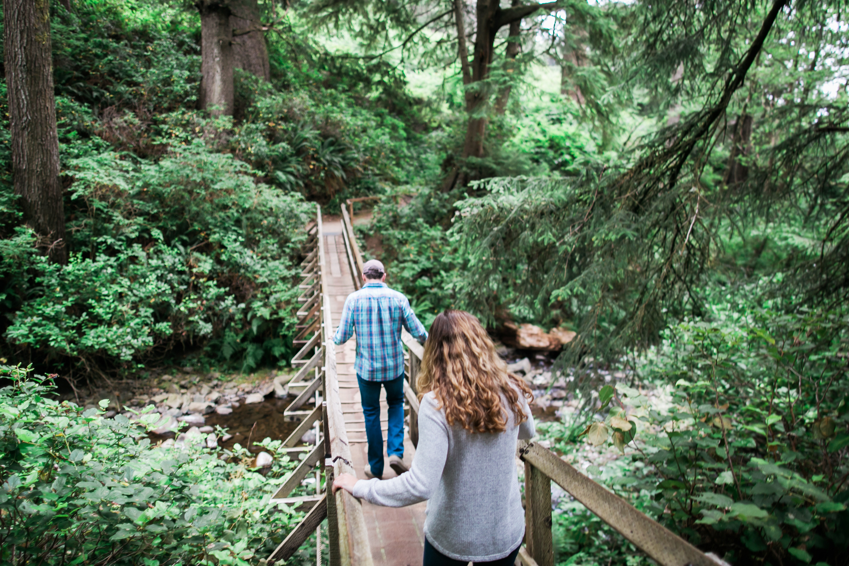 Couple walking on bridge