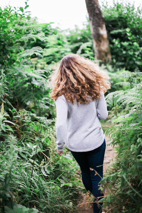 Girl running through woods