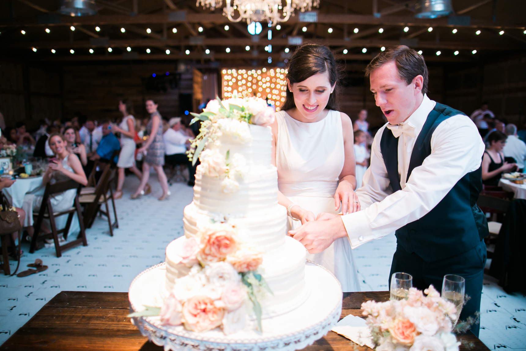 Cake cutting under cafe lights