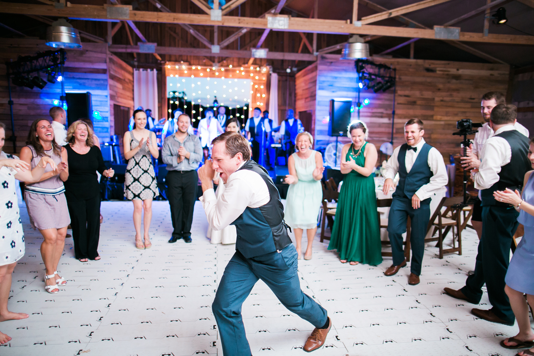 Groom dancing at wedding