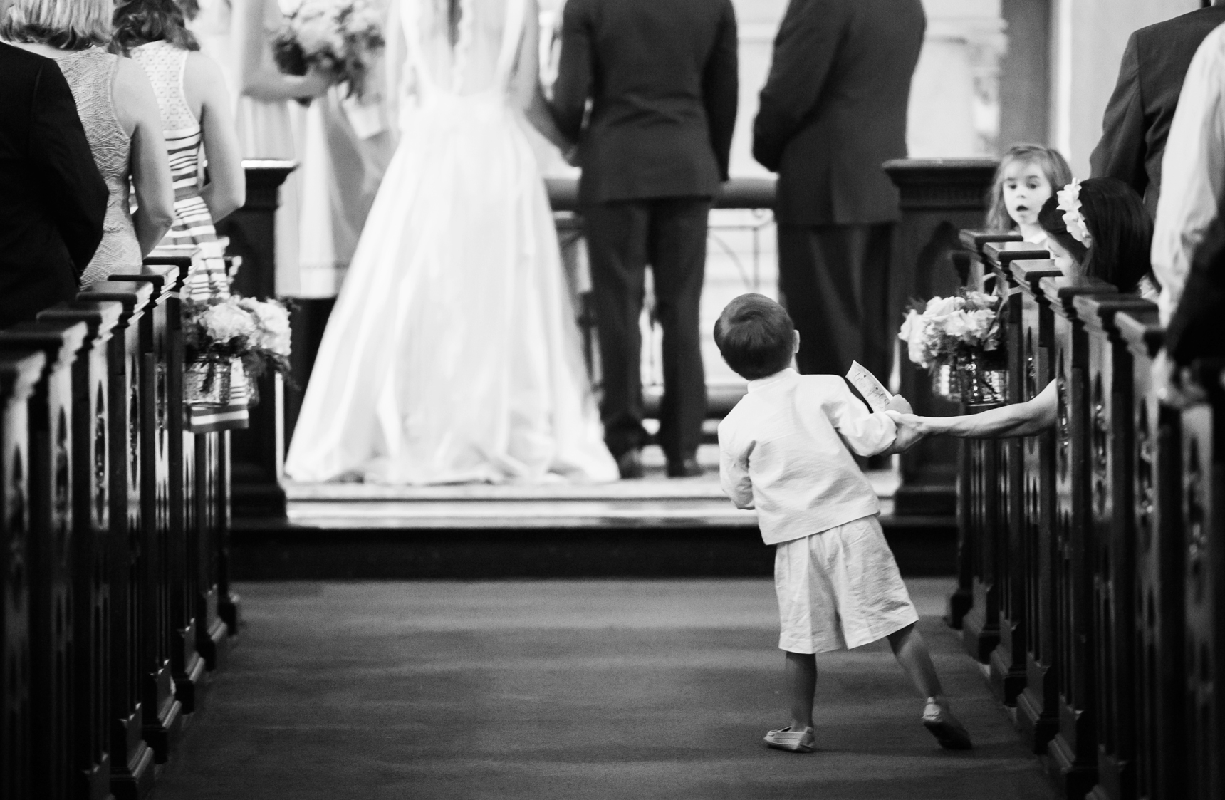 Ring bearer watching wedding