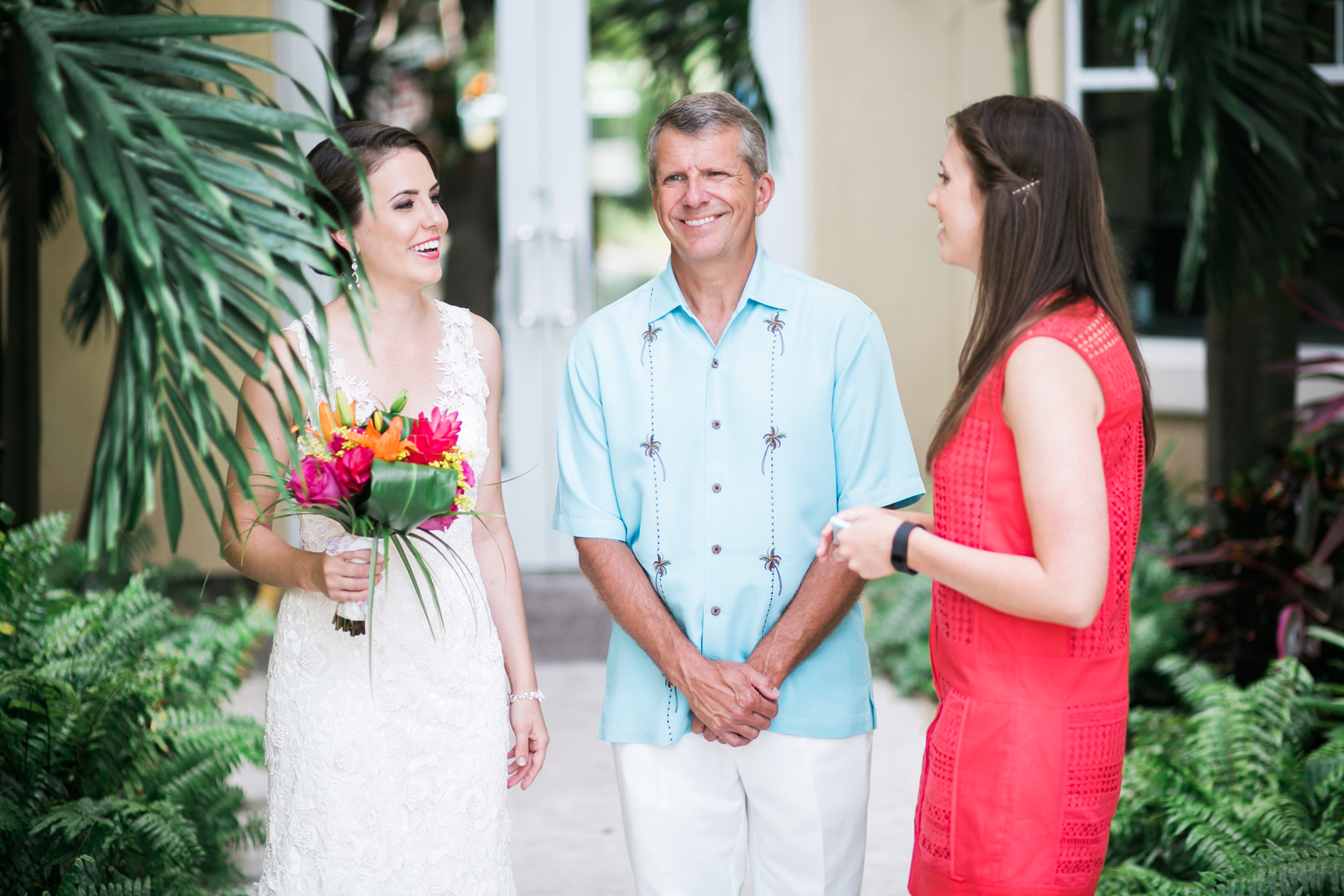 Dad with daughters on wedding day