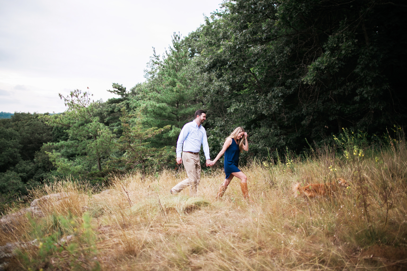 Couple walking with dog