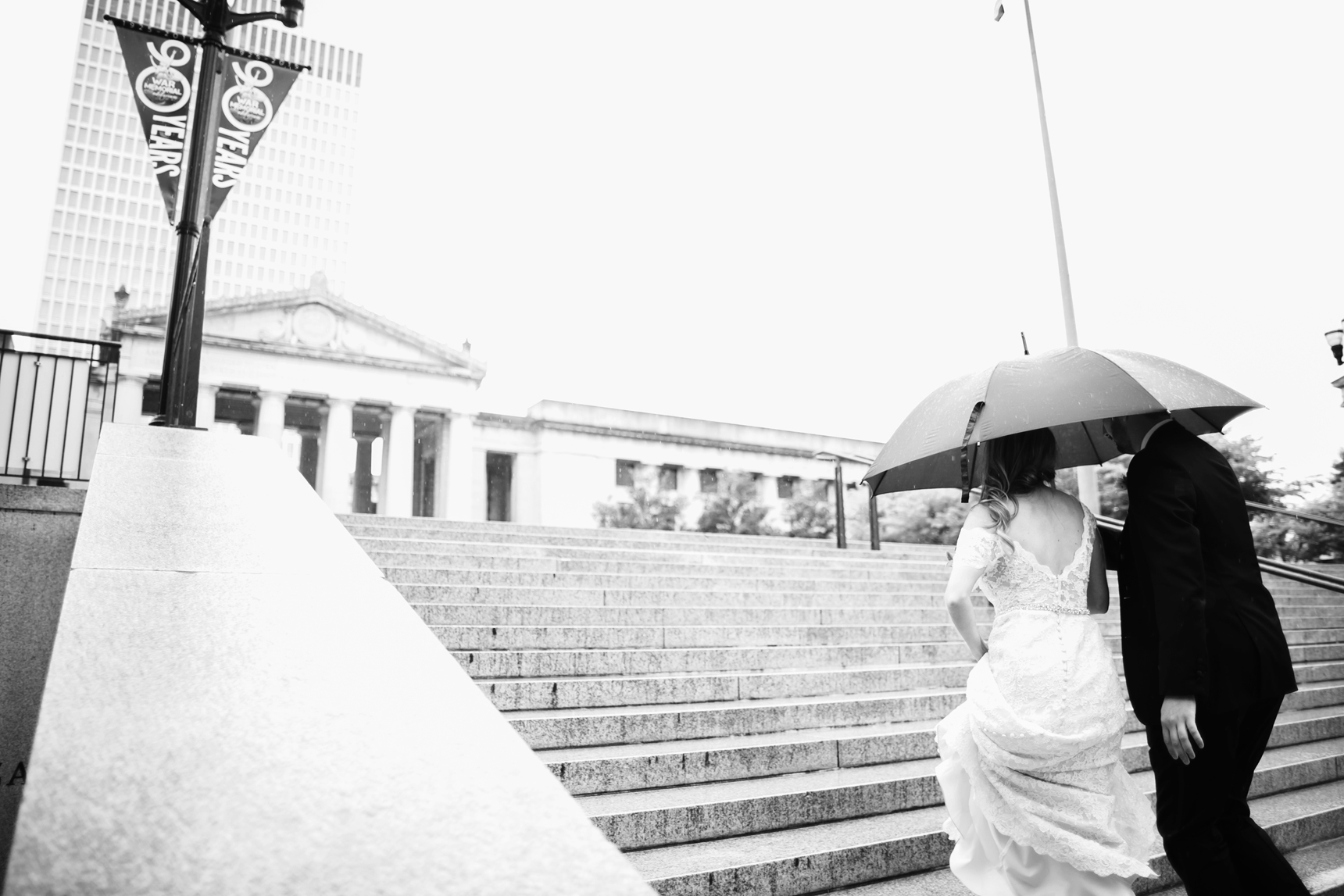 Bride and groom in rain