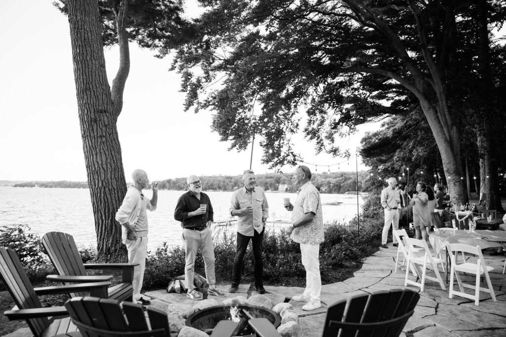 Men standing around firepit