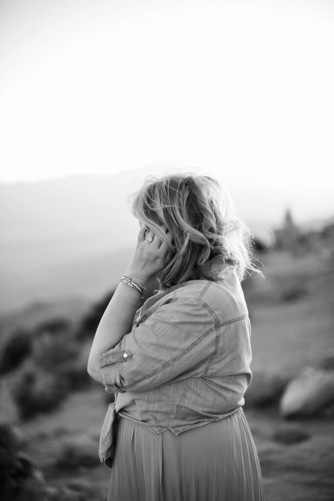 woman pushing back hair
